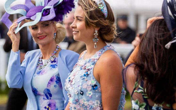 Ladies attending a raceday at Bath Racecourse.