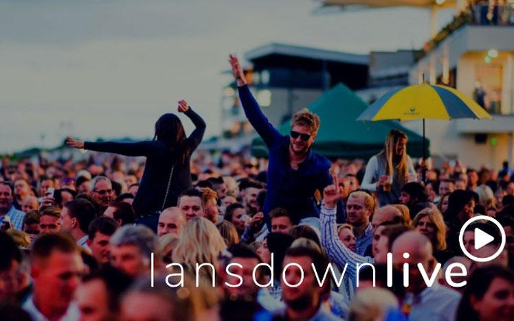 Crowds watching live concert at Bath Racecourse.