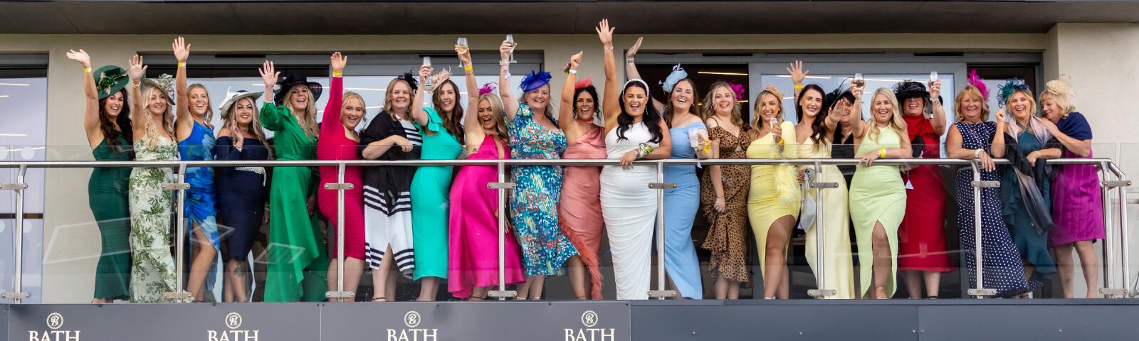 Group of women in hospitality box cheering