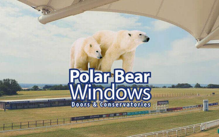 Polar Bear Windows logo overlaid on top of a photo of the Bath Racecourse track.