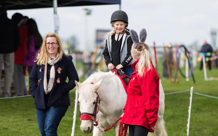 A child enjoying a pony ride at an Easter raceday at Bath Races