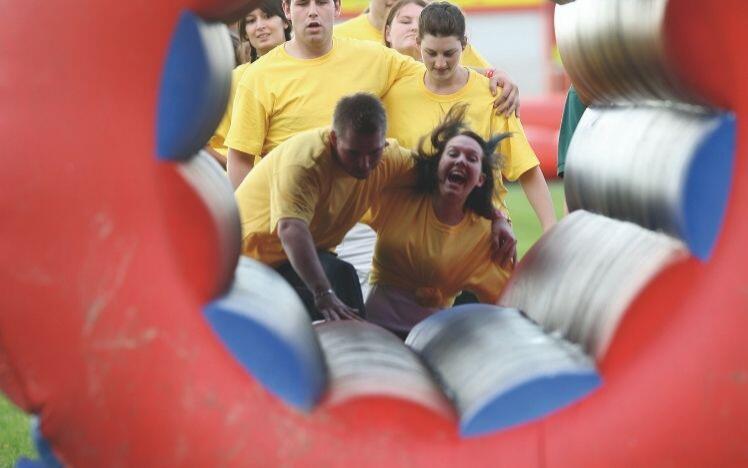 Runners head through an inflatable tunnel at Bath racecourse