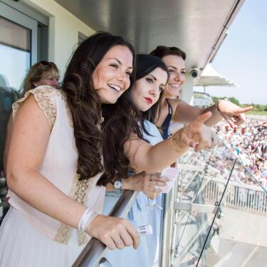Hospitality guests enjoying the view from their private balcony.
