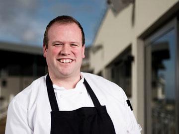 Jon Williams, the new head chef at Bath Racecourse posing for a photo.
