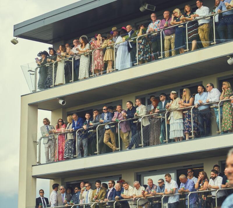 A view of all the hospitality guests on the balconies at Bath Racecourse