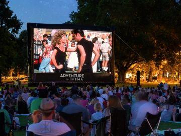 Watch 70's cult film, Grease, on the giant outdoor cinema screen at Bath Racecourse