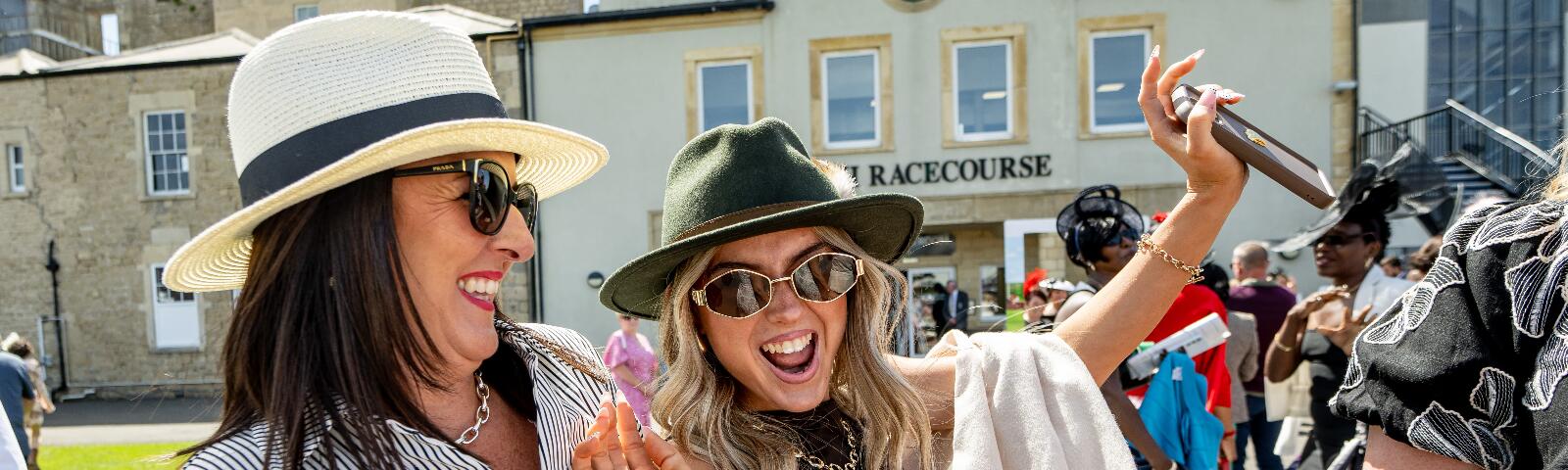 Racegoers cheering.