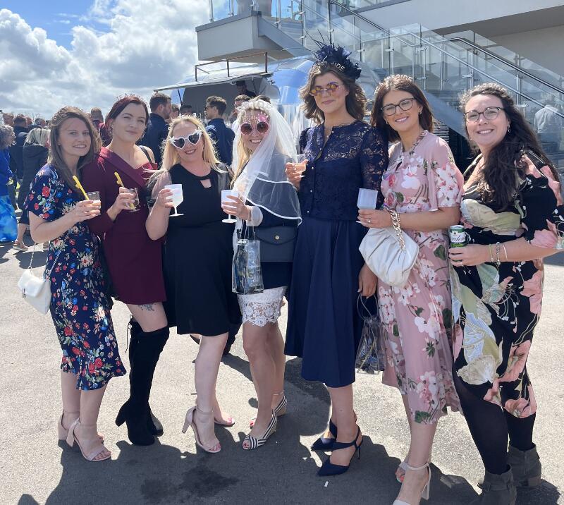 A bride to be and her bridesmaids posing for a picture at Bath Races