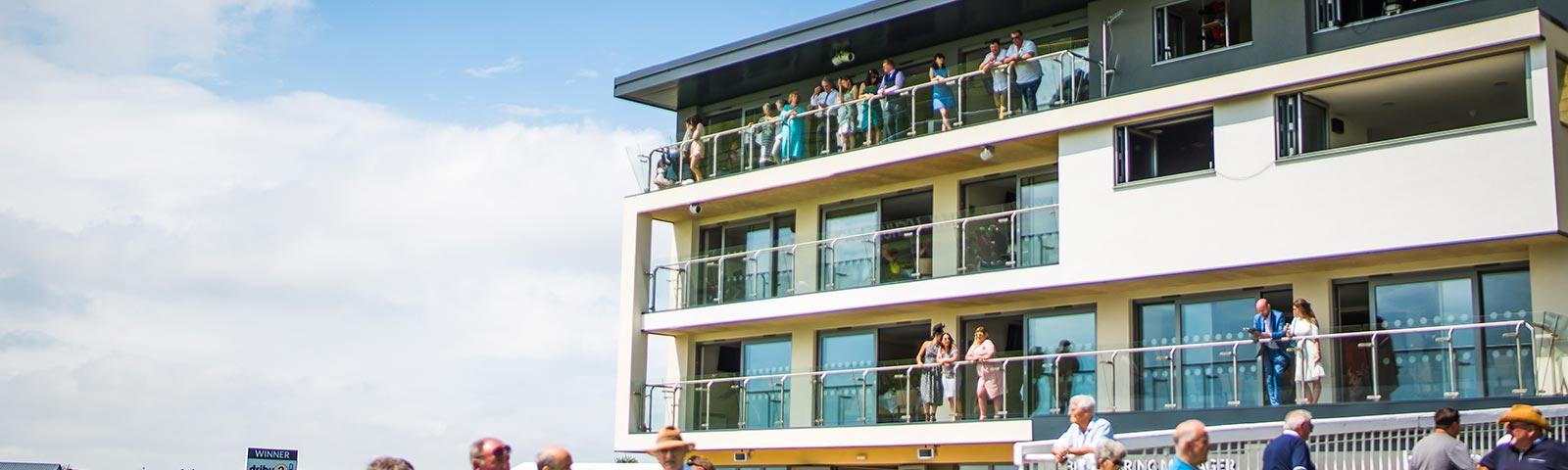 Main building at Bath Racecourse hosting a number of restaurants and suites.