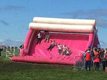 Inflatable obstacle set up at Bath Racecourse for a charity run.