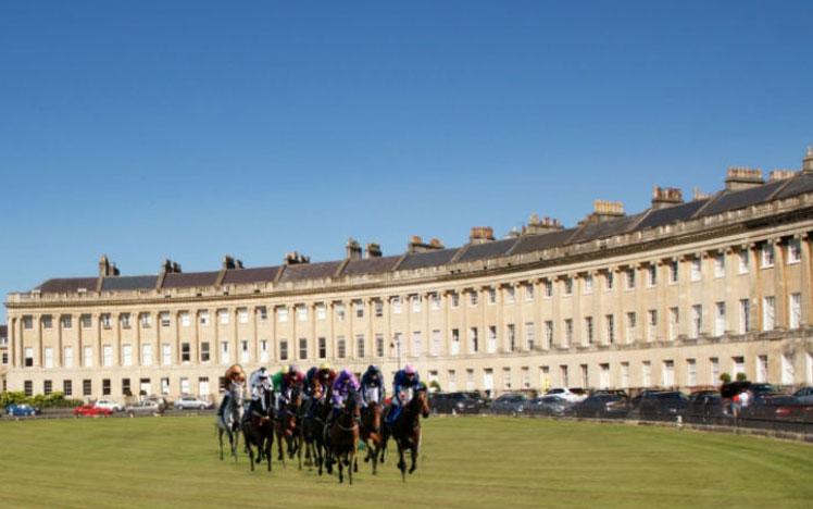 Horses racing in front of Royal Crescent in Bath.
