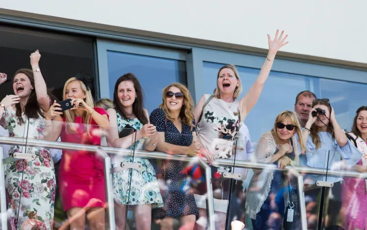 Bath Races hospitality guests cheer on the balcony