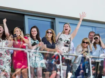 Bath Races hospitality guests cheer on the balcony